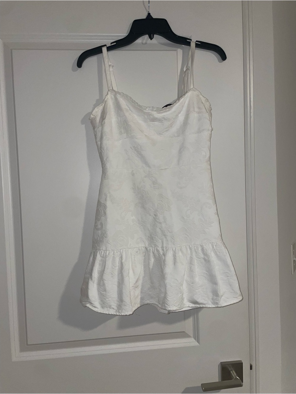 White Textured romper with Ruffle Hem